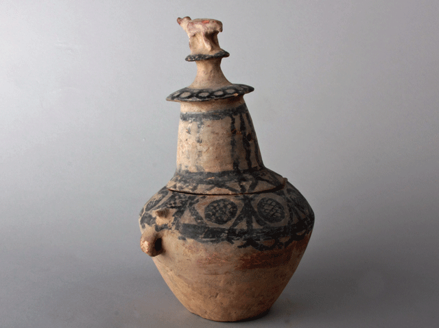 Neolithic painted jar with effigy lid